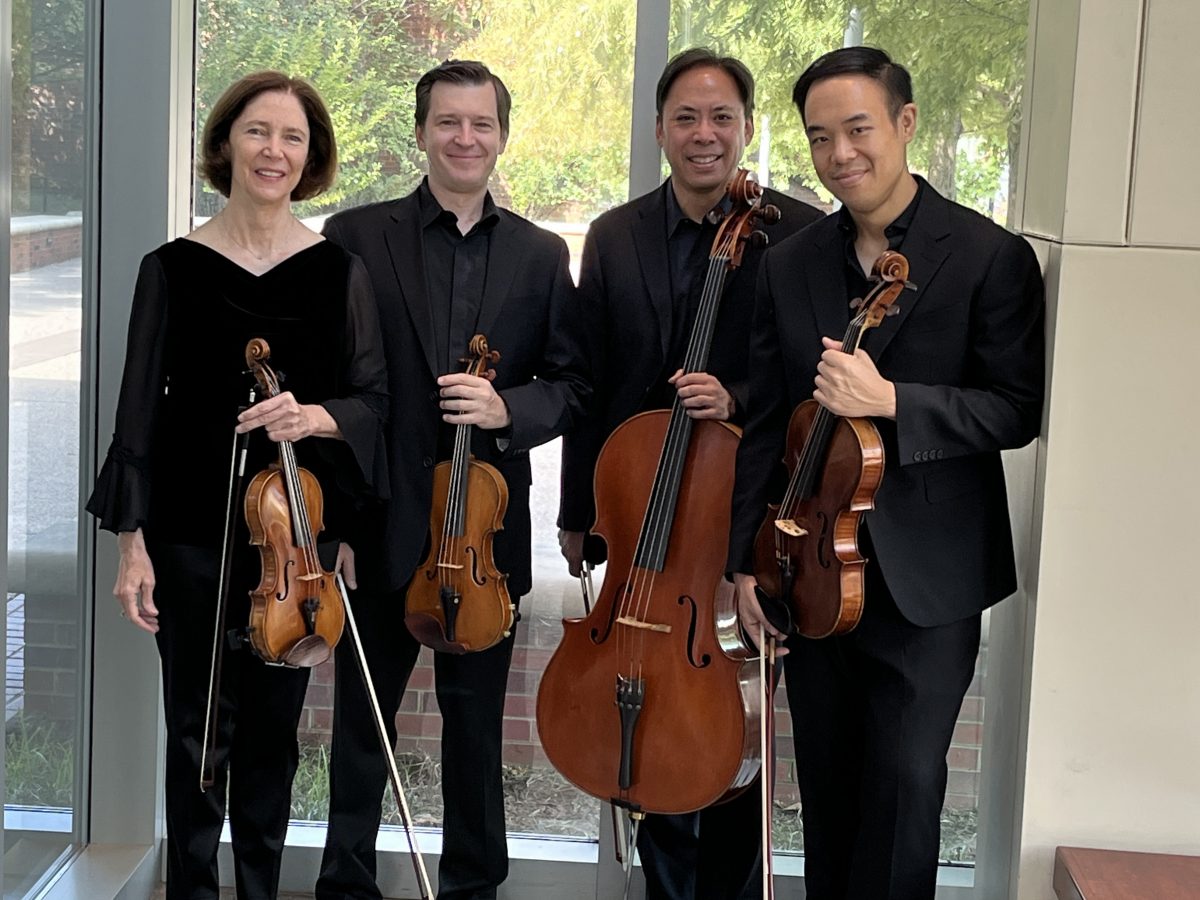 Blair String Quartet posing with their instruments